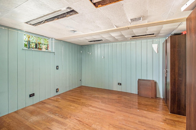 115 N Emily, Ludington, MI 49431 - below grade area featuring wood finished floors and wooden walls