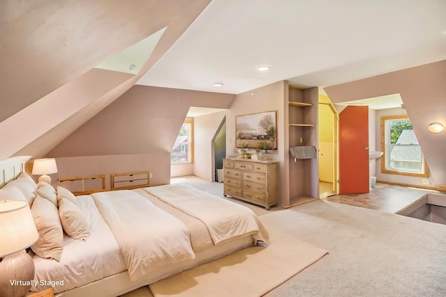 115 N Emily, Ludington, MI 49431 - bedroom featuring light colored carpet and vaulted ceiling