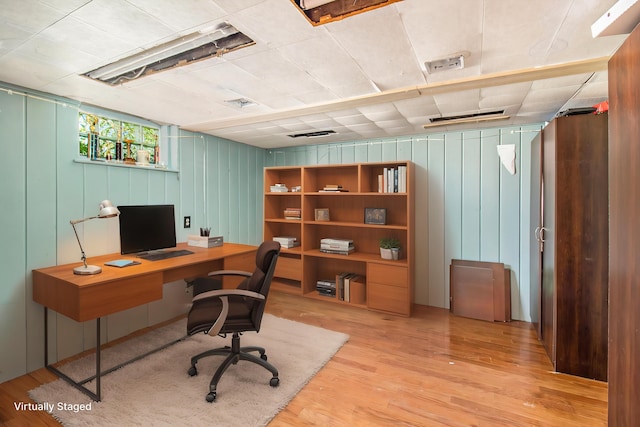 115 N Emily, Ludington, MI 49431 - office with light wood finished floors and wood walls