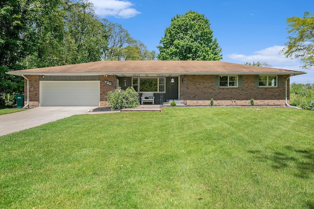 720 Riverside Dr, Constantine, MI 49042 - single story home with a front lawn, an attached garage, driveway, and brick siding