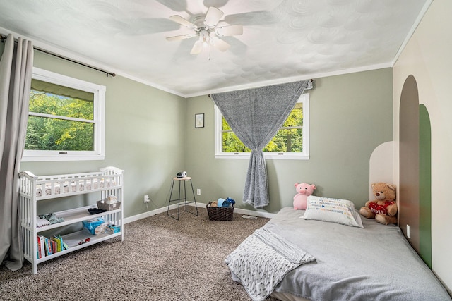 720 Riverside Dr, Constantine, MI 49042 - bedroom with carpet flooring, arched walkways, crown molding, baseboards, and a ceiling fan