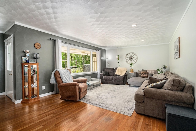 720 Riverside Dr, Constantine, MI 49042 - living area with wood finished floors, crown molding, baseboards, and recessed lighting
