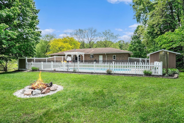 720 Riverside Dr, Constantine, MI 49042 - rear view of property featuring an outdoor fire pit and a pergola