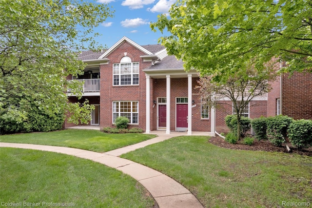 1721 Deepwood Cir, Rochester, MI 48307 - neoclassical home with a front yard, a shingled roof, brick siding, and a balcony
