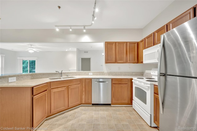1721 Deepwood Cir, Rochester, MI 48307 - kitchen with stainless steel appliances, a sink, a ceiling fan, a peninsula, and brown cabinets
