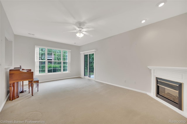 1721 Deepwood Cir, Rochester, MI 48307 - unfurnished living room with a ceiling fan, baseboards, light colored carpet, a glass covered fireplace, and recessed lighting
