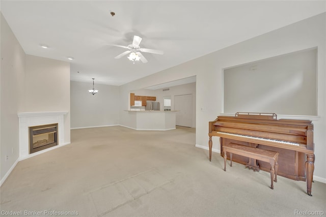 1721 Deepwood Cir, Rochester, MI 48307 - living area featuring ceiling fan, baseboards, light carpet, a chandelier, and a glass covered fireplace