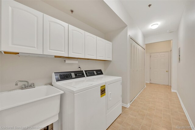 1721 Deepwood Cir, Rochester, MI 48307 - laundry area with cabinet space, washer and dryer, and baseboards