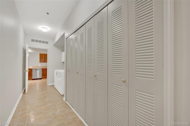 1721 Deepwood Cir, Rochester, MI 48307 - hallway featuring independent washer and dryer and baseboards