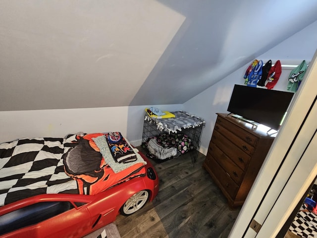 527 Jones St, Grand Ledge, MI 48837 - bedroom featuring wood finished floors and vaulted ceiling