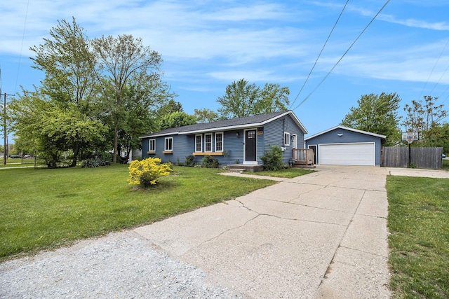 1988 Kregel Ave, Muskegon, MI 49442 - ranch-style house featuring an outdoor structure and a detached garage