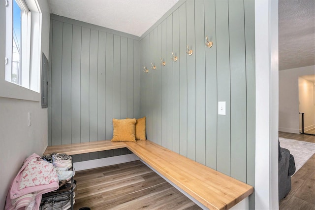 1988 Kregel Ave, Muskegon, MI 49442 - mudroom with wood finished floors, a textured ceiling, and wooden walls