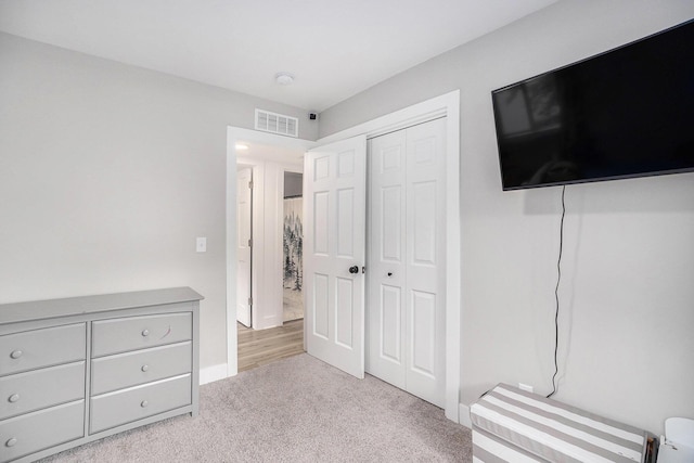 1988 Kregel Ave, Muskegon, MI 49442 - unfurnished bedroom featuring carpet floors, a closet, and baseboards