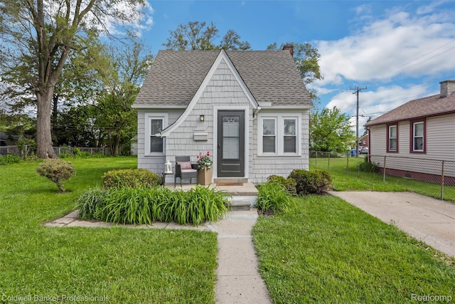 7283 Lozier Ave, Warren, MI 48091 - view of front of house with roof with shingles and a chimney