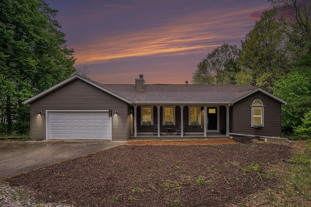 7431 W Buchanan Rd, Shelby, MI 49455 - ranch-style home with driveway, covered porch, a chimney, an attached garage, and a shingled roof