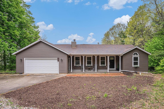 7431 W Buchanan Rd, Shelby, MI 49455 - ranch-style house with covered porch, asphalt driveway, a chimney, an attached garage, and roof with shingles