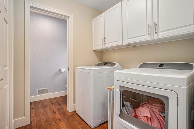 7431 W Buchanan Rd, Shelby, MI 49455 - laundry room with independent washer and dryer, wood finished floors, cabinet space, and baseboards