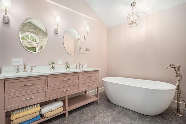 7431 W Buchanan Rd, Shelby, MI 49455 - bathroom featuring double vanity, lofted ceiling, and a freestanding tub