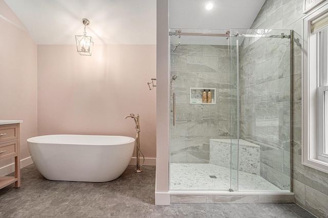 7431 W Buchanan Rd, Shelby, MI 49455 - bathroom with a freestanding bath, a shower stall, and lofted ceiling