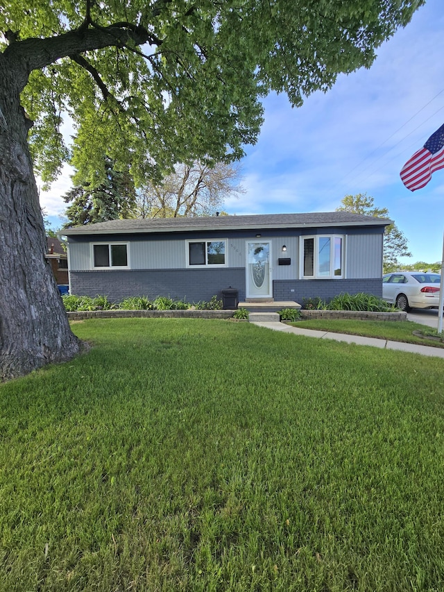 5966 Engleman Ave, Warren, MI 48091 - ranch-style house with a front lawn, brick siding, and a shingled roof