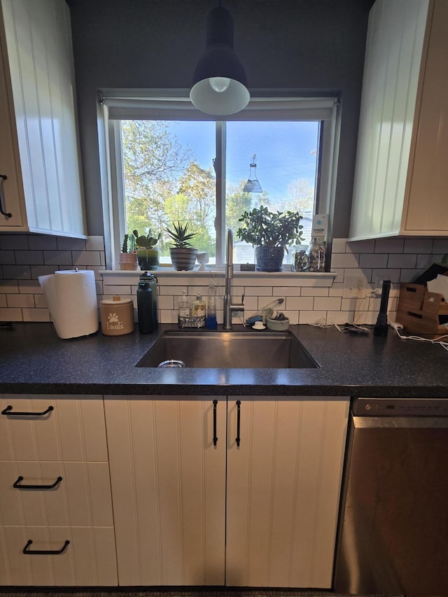 5966 Engleman Ave, Warren, MI 48091 - kitchen featuring dishwasher, a sink, white cabinetry, and dark countertops