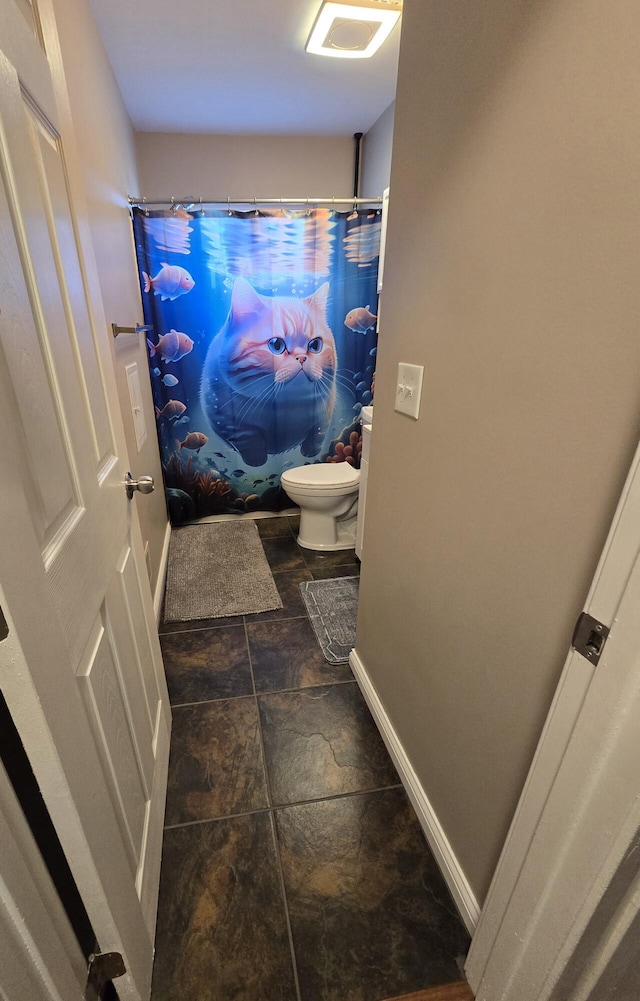 5966 Engleman Ave, Warren, MI 48091 - full bathroom featuring toilet, baseboards, a shower with shower curtain, and stone finish flooring