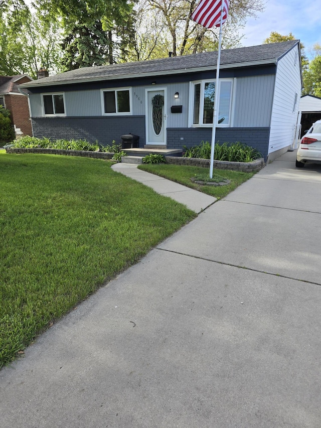 5966 Engleman Ave, Warren, MI 48091 - single story home with brick siding, a front lawn, roof with shingles, and driveway