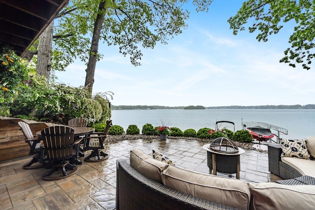 1548 Indian Trl, Pleasant Lake, MI 49272 - view of patio featuring an outdoor living space with a fire pit, a water view, and outdoor dining space