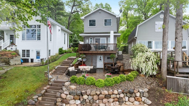 1548 Indian Trl, Pleasant Lake, MI 49272 - rear view of property featuring stairs, outdoor lounge area, a patio area, a deck, and a yard