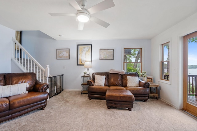 1548 Indian Trl, Pleasant Lake, MI 49272 - carpeted living area with baseboards, a ceiling fan, and stairs