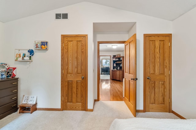 1548 Indian Trl, Pleasant Lake, MI 49272 - bedroom with vaulted ceiling, baseboards, and light colored carpet