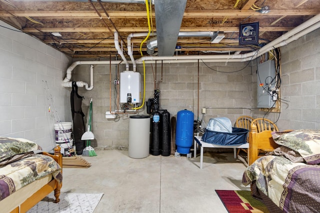 1548 Indian Trl, Pleasant Lake, MI 49272 - unfinished below grade area featuring tankless water heater, a water pressure tank, electric panel, a water softener, and concrete block wall