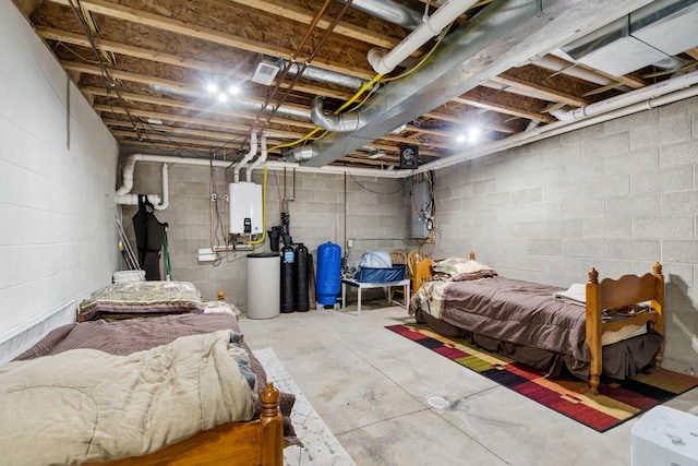 1548 Indian Trl, Pleasant Lake, MI 49272 - bedroom with unfinished concrete flooring and tankless water heater