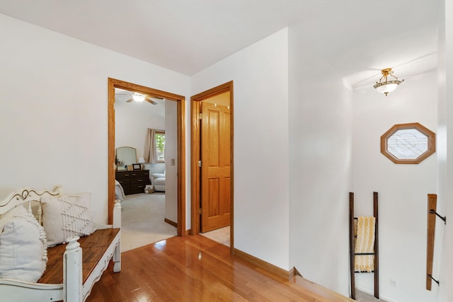 1548 Indian Trl, Pleasant Lake, MI 49272 - hallway with wood finished floors, an upstairs landing, and baseboards