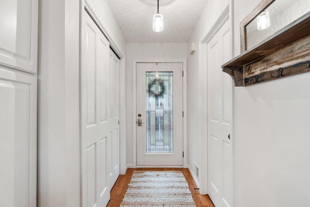 1548 Indian Trl, Pleasant Lake, MI 49272 - doorway to outside with light wood-style floors and baseboards
