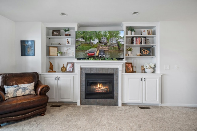 1548 Indian Trl, Pleasant Lake, MI 49272 - living area featuring carpet flooring, a tile fireplace, built in shelves, and recessed lighting