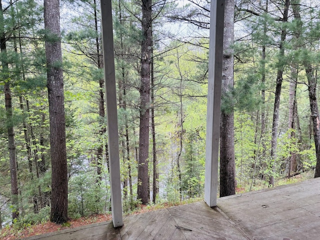 4375 W Haskell Lake Rd, Harrison, MI 48625 - deck featuring a view of trees