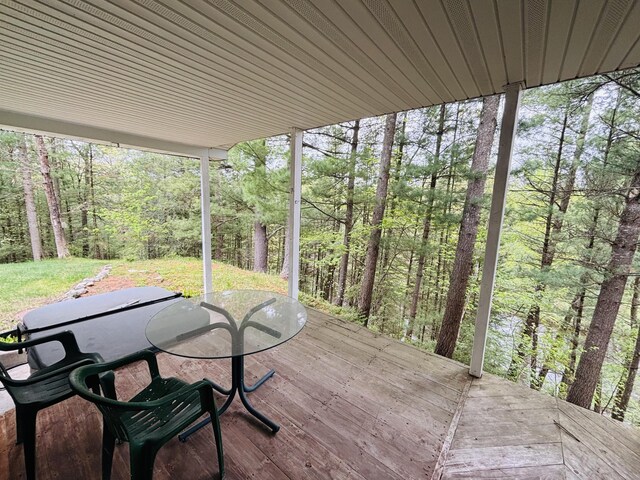 4375 W Haskell Lake Rd, Harrison, MI 48625 - wooden deck with a wooded view and outdoor dining area