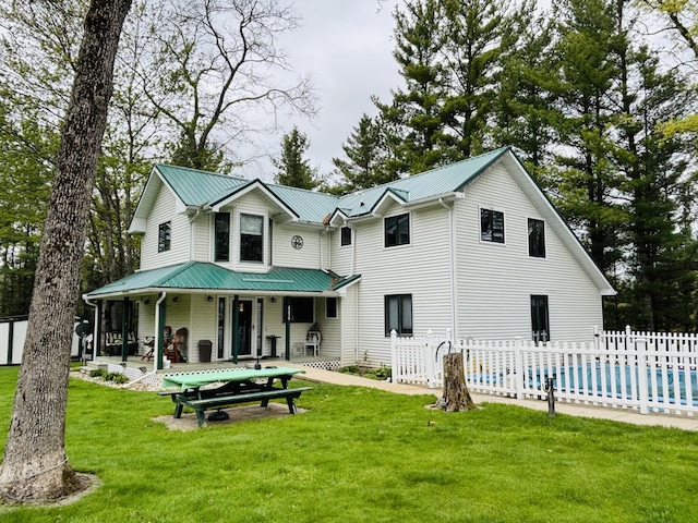 4375 W Haskell Lake Rd, Harrison, MI 48625 - rear view of house with a metal roof