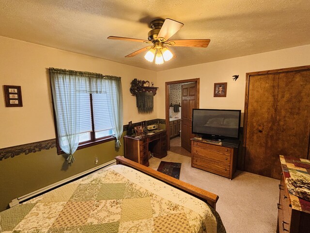 4375 W Haskell Lake Rd, Harrison, MI 48625 - bedroom featuring carpet, a baseboard heating unit, a textured ceiling, and ceiling fan