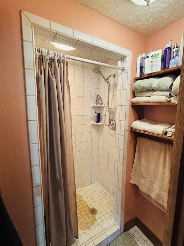 4375 W Haskell Lake Rd, Harrison, MI 48625 - bathroom featuring a shower stall and a textured ceiling