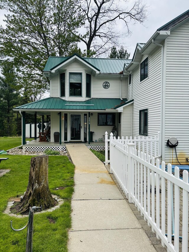 4375 W Haskell Lake Rd, Harrison, MI 48625 - view of front facade with a porch and a metal roof