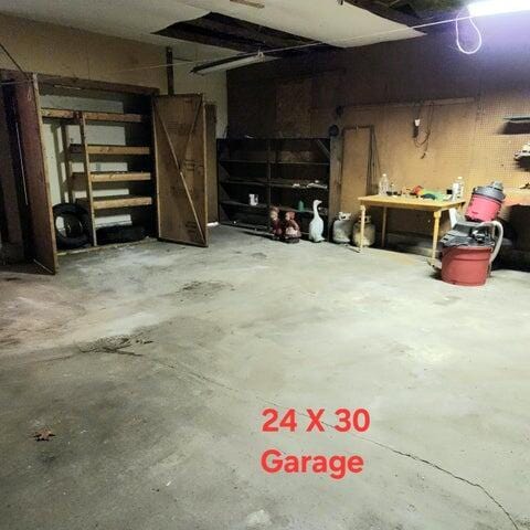 5678 Leona Ave, Muskegon, MI 49442 - garage with a workshop area