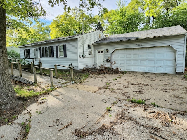 5678 Leona Ave, Muskegon, MI 49442 - view of front of property with a garage