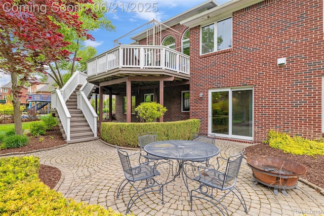 55161 Whitney Dr, Shelby Twp, MI 48315 - view of patio featuring an outdoor fire pit, stairs, a deck, and outdoor dining space