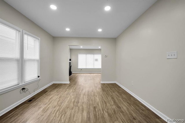 14850 Ilene St, Detroit, MI 48238 - spare room featuring baseboards, wood finished floors, recessed lighting, and a fireplace