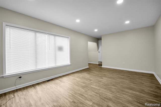 14850 Ilene St, Detroit, MI 48238 - empty room with wood finished floors, baseboards, and recessed lighting