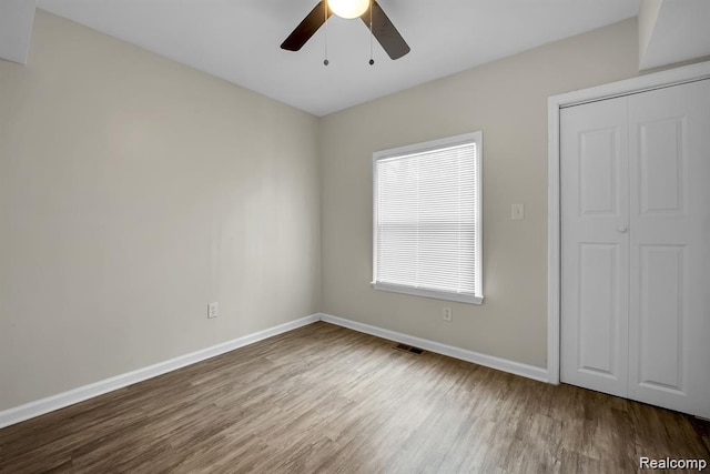 14850 Ilene St, Detroit, MI 48238 - unfurnished bedroom featuring wood finished floors, baseboards, and a ceiling fan