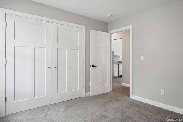 1759 2nd St, Taylor, MI 48192 - unfurnished bedroom featuring carpet floors, baseboards, a closet, and freestanding refrigerator