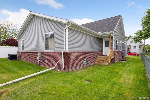 1759 2nd St, Taylor, MI 48192 - view of property exterior with brick siding, roof with shingles, and central AC